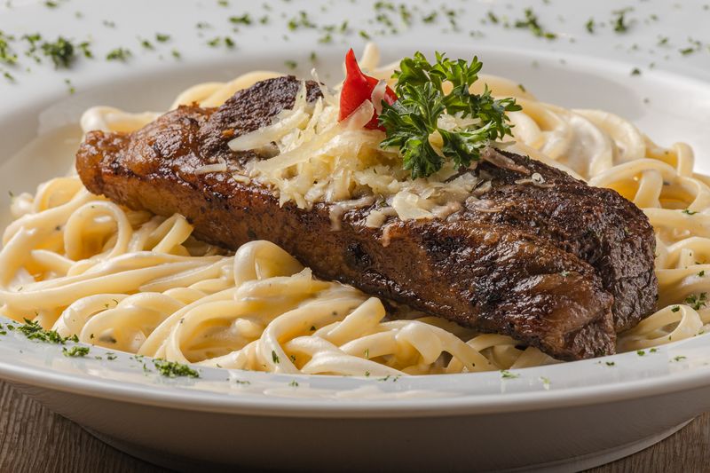 Creamy Chicken Alfredo pasta with grilled chicken strips