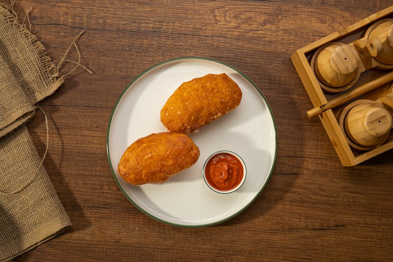 Golden fried mozzarella sticks with marinara dipping sauce