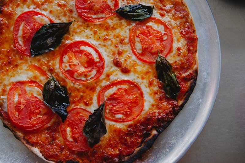 Classic Margherita pizza with fresh basil and mozzarella